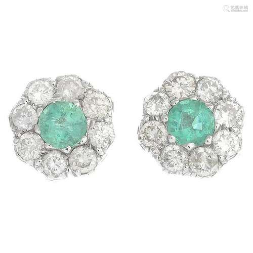 A pair of emerald and diamond cluster