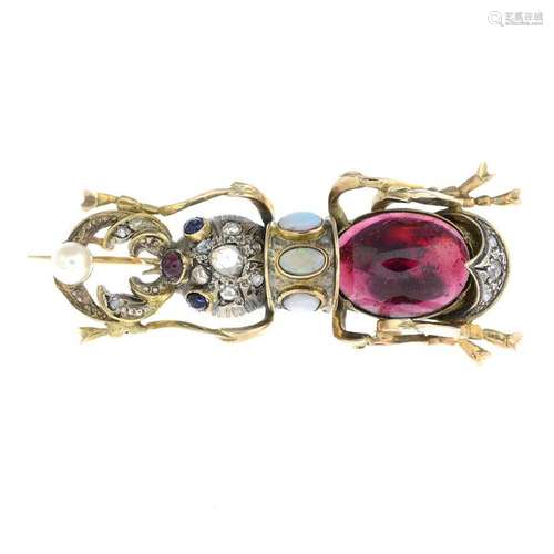 A diamond and gem-set stag beetle brooch.Length 5.5cms.