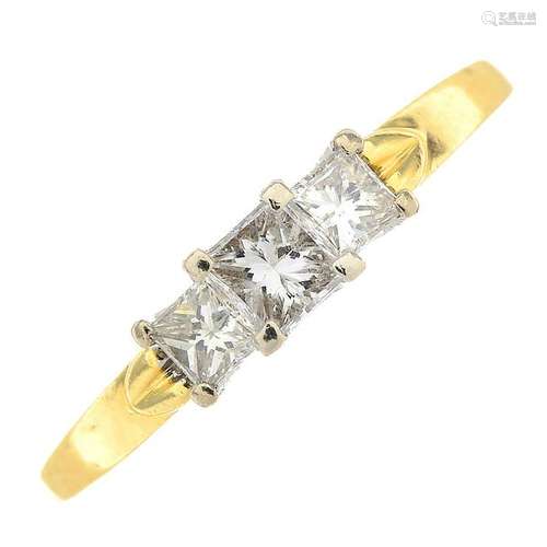 An 18ct gold diamond three-stone ring. Total diamond