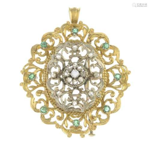 A diamond and emerald pendant. May be worn as a brooch.