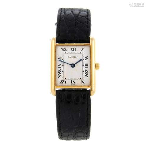 CARTIER - a Tank wrist watch. Yellow metal case,