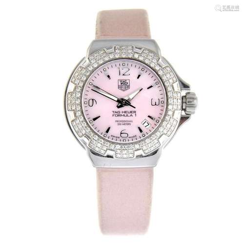 TAG HEUER - a lady's Formula 1 wrist watch. Stainless