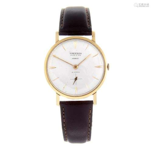 FREESON - a gentleman's wrist watch. 18ct yellow gold