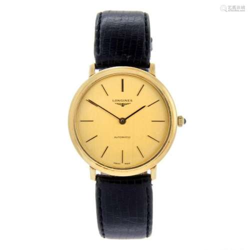 LONGINES - a gentleman's wrist watch. Yellow metal