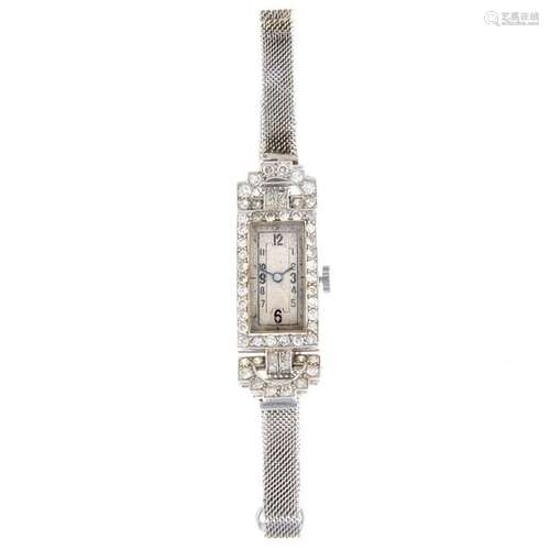 A lady's cocktail watch. White metal case with diamond