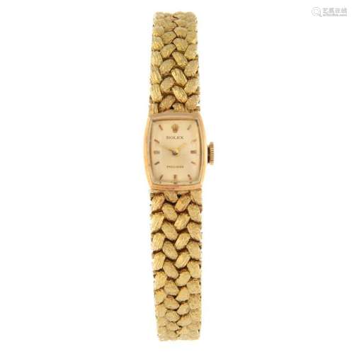 ROLEX - a lady's bracelet watch. Yellow metal case,