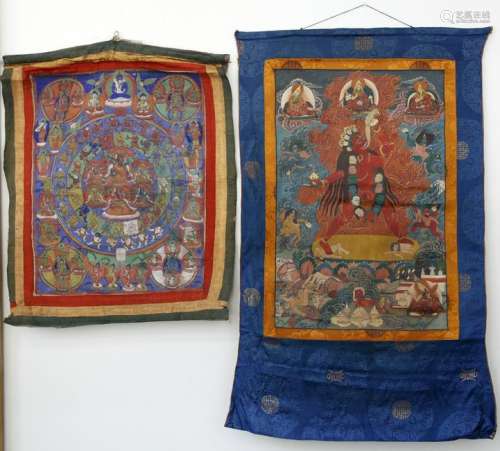 Two Tibetan Thangkas Mounted with Brocade