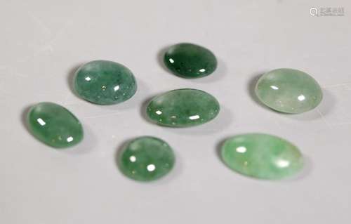 - 7 Chinese Natural Green Jadeite Double Cabochons