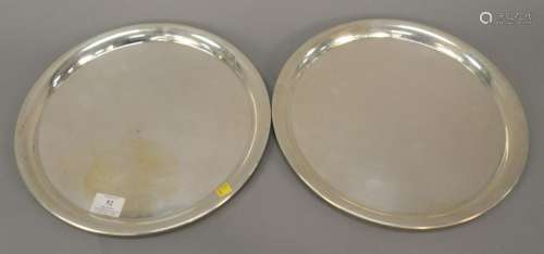 Pair of sterling silver round trays, dia. 13 3/8 in.,