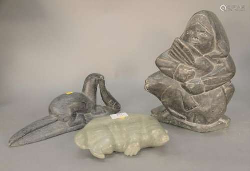 Three Eskimo soapstone figures; seal with fish signed
