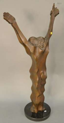 Large bronze sculpture of two figures with arms up on a
