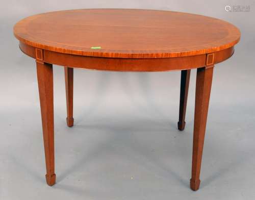 Kindel oval mahogany extending table, 38