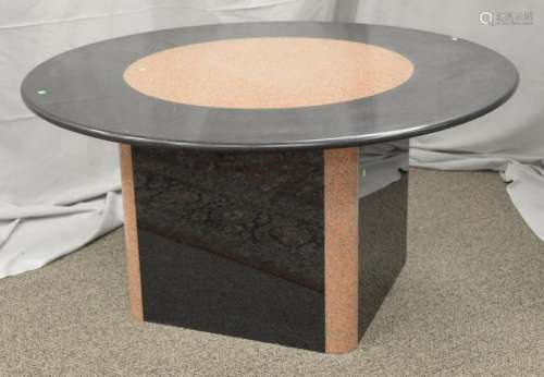 Round granite table, mixed black and tan marble having