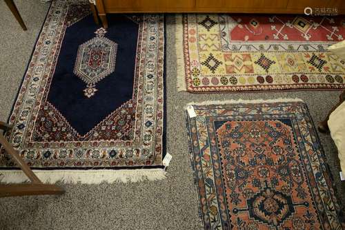 Three Oriental rugs. 3' x 7', 3' x 5', 2'3