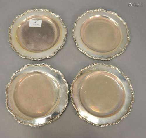 Four sterling silver bread plates, dia. 7 in., troy