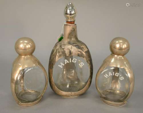 Three Haig three sided bottles with silver holders,
