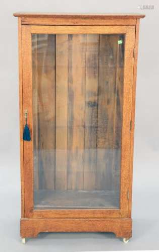 Oak one door cabinet, ht. 55 1/2 in., wd. 27 1/2 in.