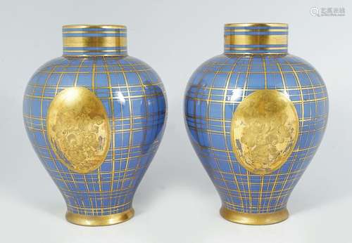 PAIR OF FRENCH PORCELAIN AND PARCEL GILT VASES