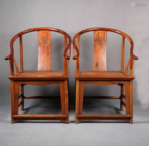 AN EXTREMELY RARE AND IMPORTANT PAIR OF HUANGHUALI HORSESHOE-BACK ARMCHAIRS, QUANYI