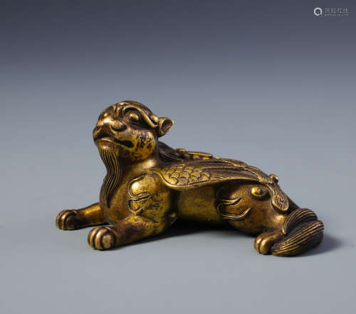 A Finely Cast Chinese Gilt Bronze Mythical Beast Paper Weight