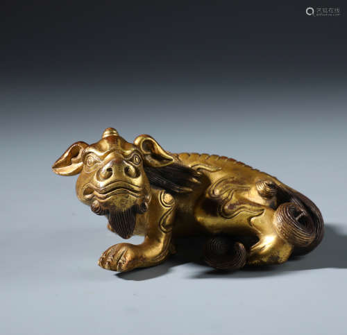 A Finely Carved Chinese Gilt Bronze Lion Paper Weight