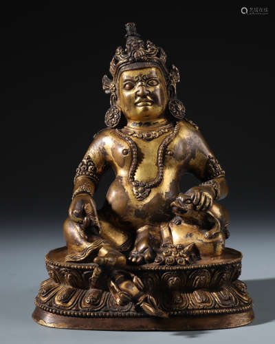 A Chinese Carved Gilt Bronze Figure of Jambhala