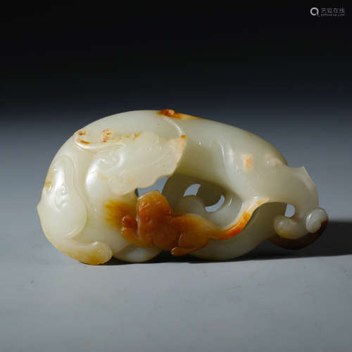 A Rare Chinese Carved White and Russet Jade Openwork Chilong Pendent