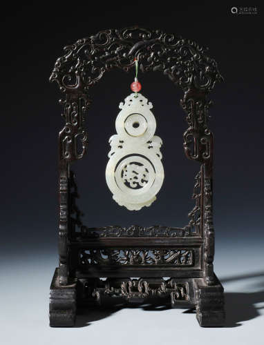 A Rare Chinese Carved White Jade Revolved Double Gourd Pendent and Stand