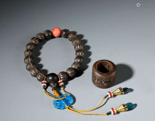 A Finely Carved Chinese Aloeswood  Rosary Bracelet and Thumb Ring Set