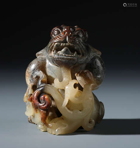 A Fine Chinese archaistic White and Russet Jade Bear