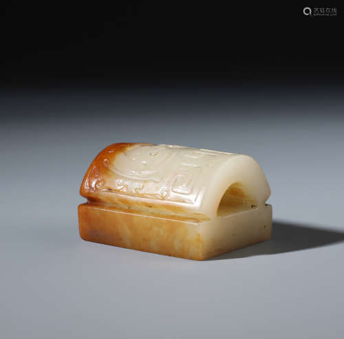 A Chinese Carved White and Russet Jade Arched Seal