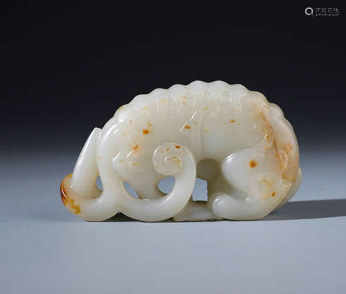 A Fine Chinese Carved White and Russet Jade Lion