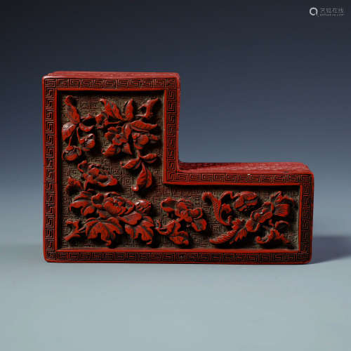 A Chinese Cinnabar shaped box and cover