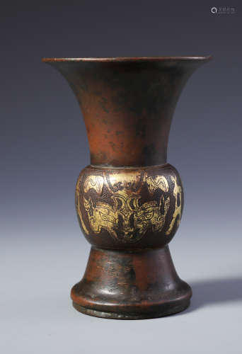 An Unusual Parcel-gilt Bronze 'Taotie Mask' Beaker Vase, Gu