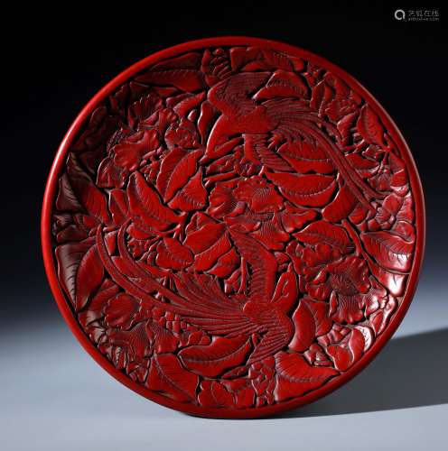 An Imperial Chinese Carved Red Lacquer Cinnabar Plate of Flowers and Phoenix