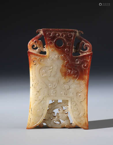 A Chinese Carved White and Russet Jade Axe