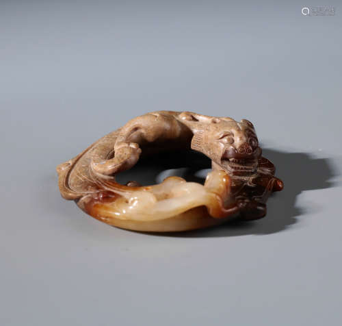 A Chinese Carved Archaistic Russet Jade Bi