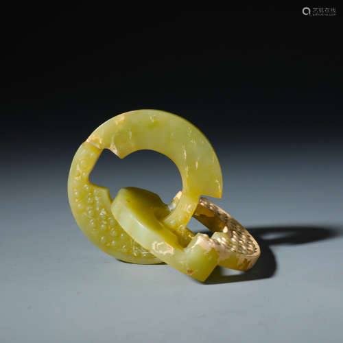A Chinese Carved archaistic Yellow Jade Bi