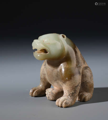 A Chinese Carved White and Russet Jade Bear