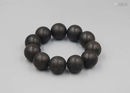 A Chinese Carved Agar-Wood Bracelet