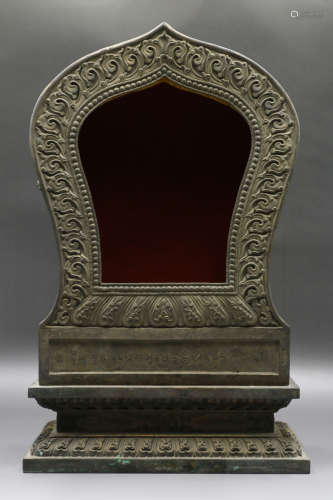 A Chinese Carved Silver Buddha Niche