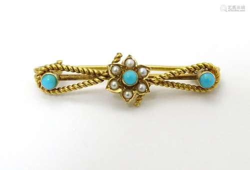 A c1900 gold and gilt metal brooch set with turquoise