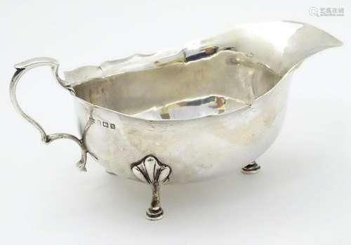 A silver sauce boat hallmarked Birmingham 1925 maker