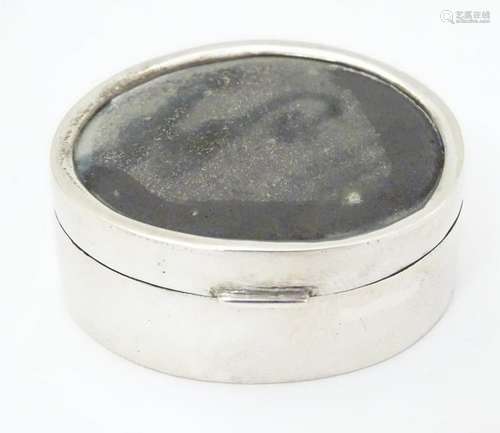 A 925 silver pill box with cabochon to lid. 1 Â½'' wide