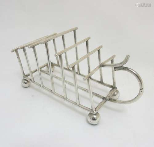 An earl 20thC silver plate 6-division toast rack marked