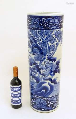 A Chinese blue and white stick/umbrella stand,