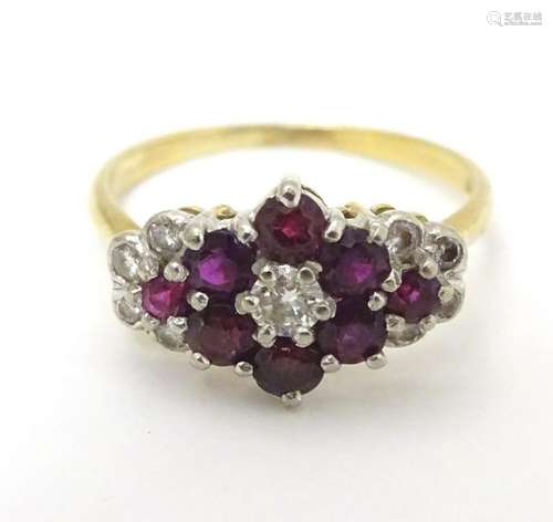 An 18ct gold ring set with rubies and diamonds.