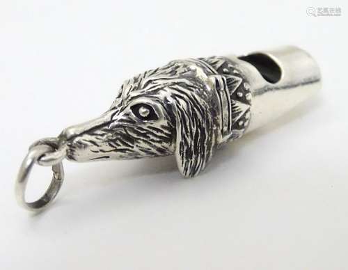 A 925 silver novelty whistle with dogs head decoration