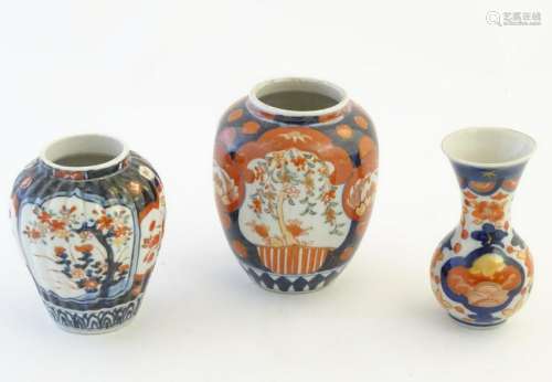 Three Imari vases decorated with panelled floral