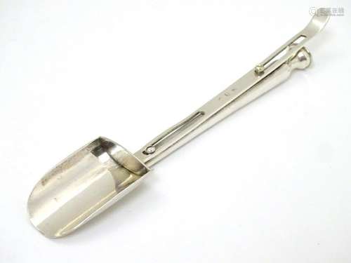 A Continental white metal cheese / stilton scoop  with